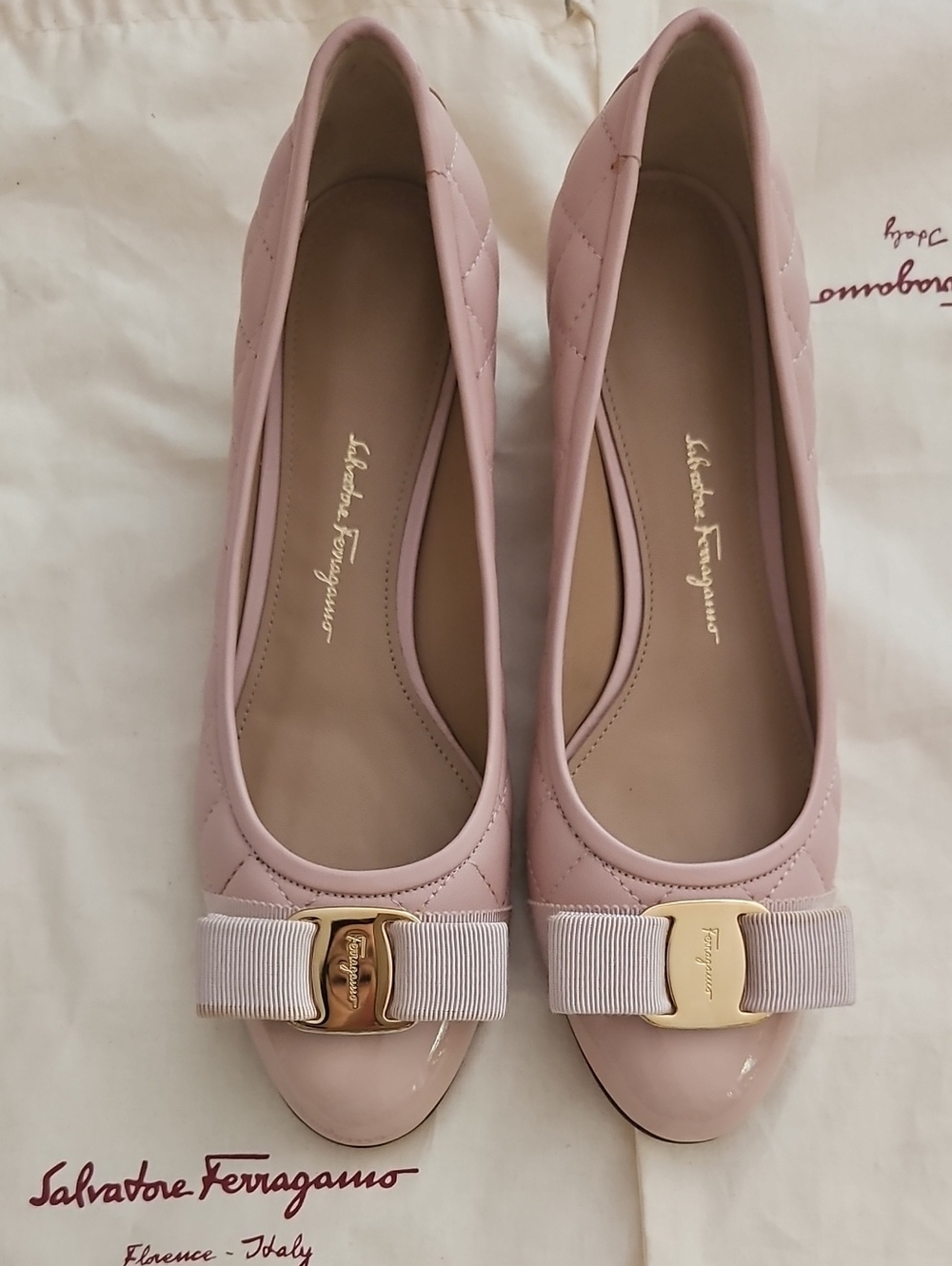 Salvatore Ferragamo Light Pink Quilted Vara Bow Leather Pumps.